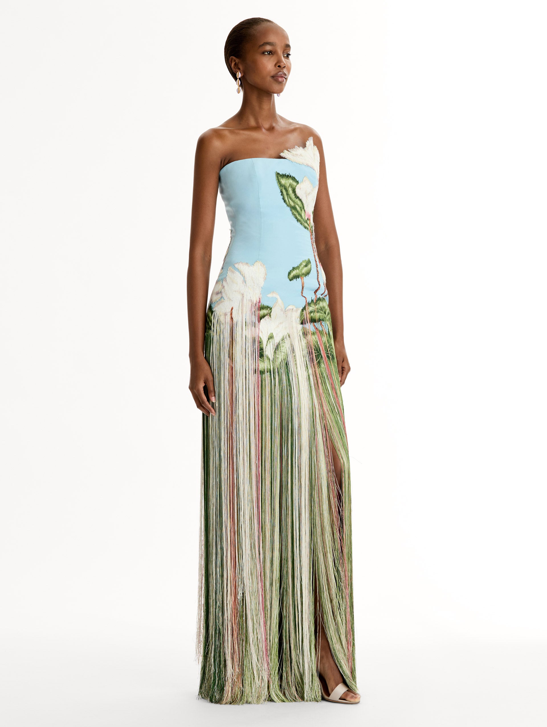 Strapless, Floor length silk faille gown with Chiné Cyclamen motif on threadwork fringe. Clean lines and a fitted bodice frame the  embroidery. Side View.