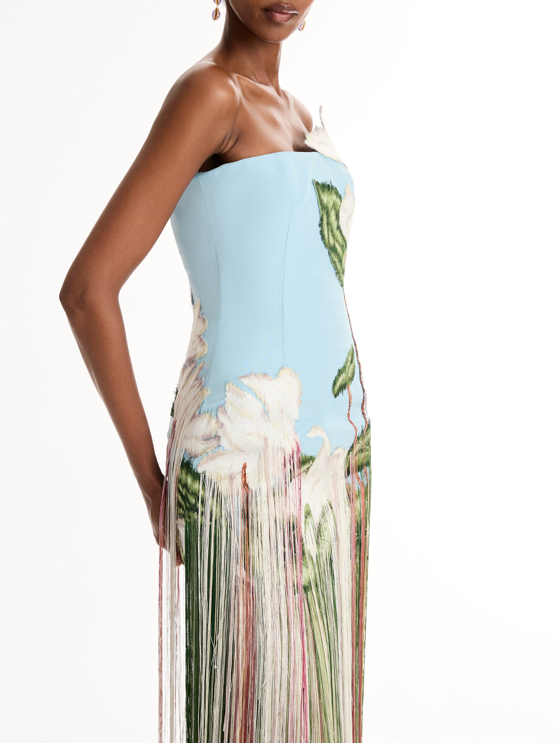 Strapless, Floor length silk faille gown with Chiné Cyclamen motif on threadwork fringe. Clean lines and a fitted bodice frame the  embroidery. Close Up Side View.