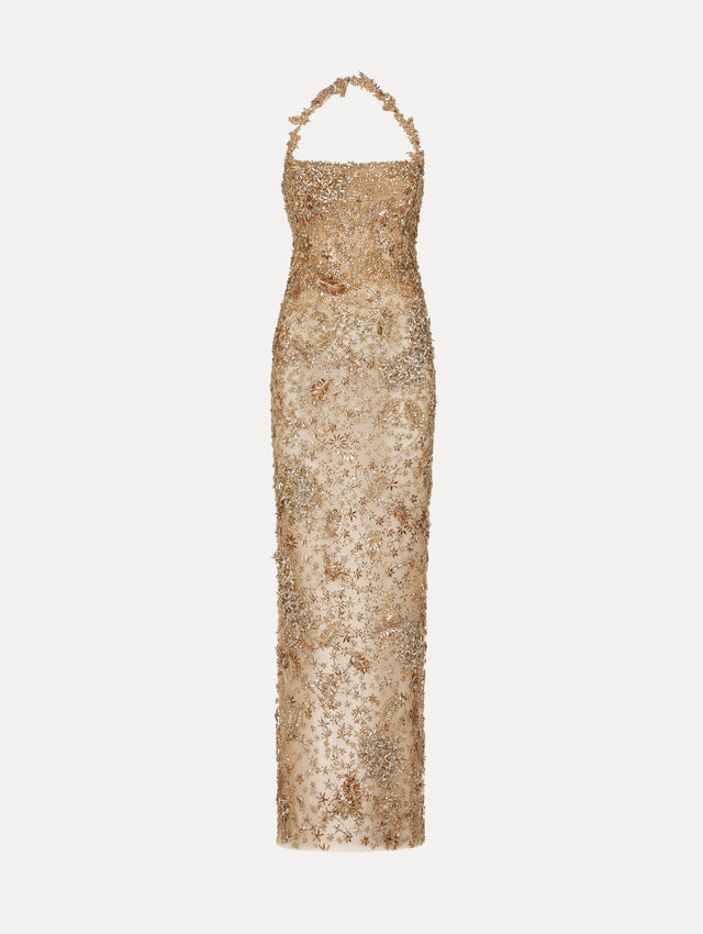 Dress in the color Gold featuring a halter neckline and adorned with floral, crystal beaded embroidery.