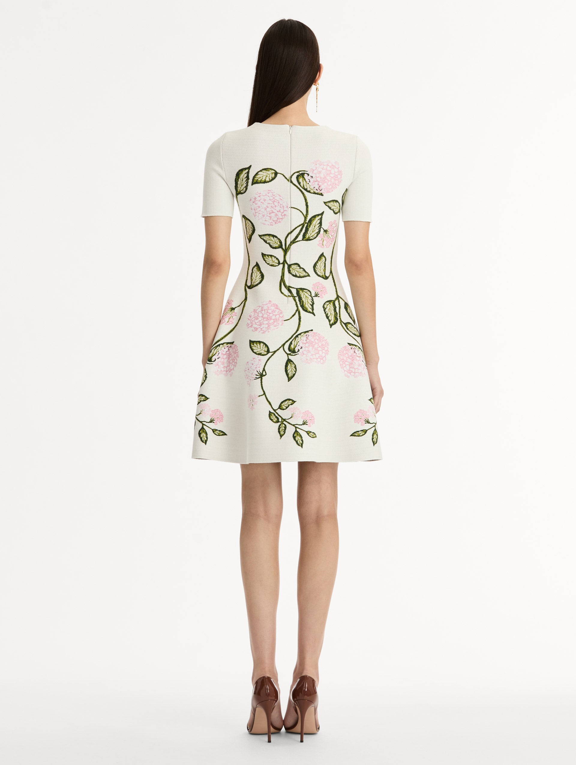 Ivory Jacquard knit dress with porcelain flower print along silhouette. Short Sleeve Mini Dress. Back View. 