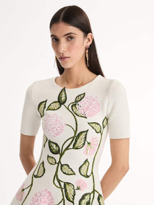 Ivory Jacquard knit dress with porcelain flower print along silhouette. Short Sleeve Mini Dress. Front View, Close Up. 