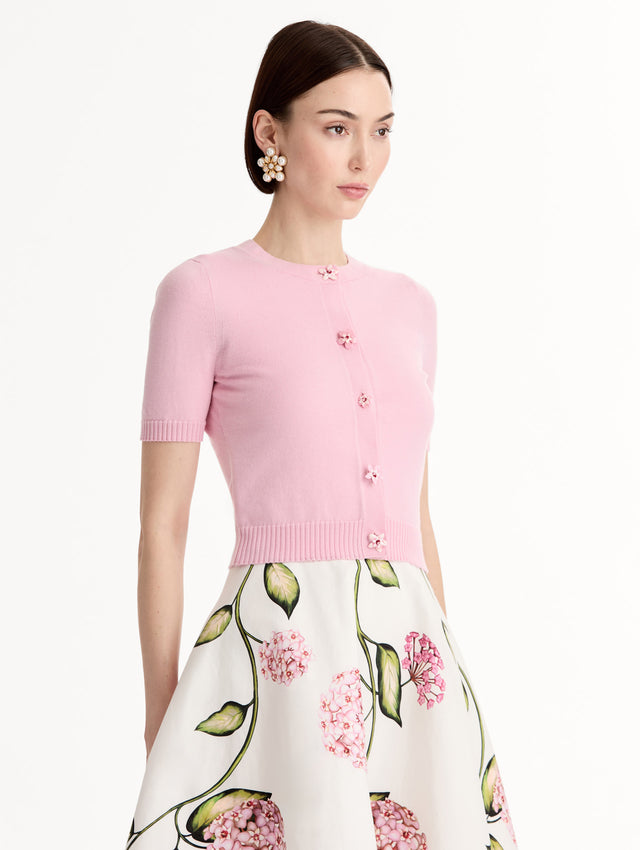 Light pink cropped cardigan, Floral Button closure, short sleeves. Side View