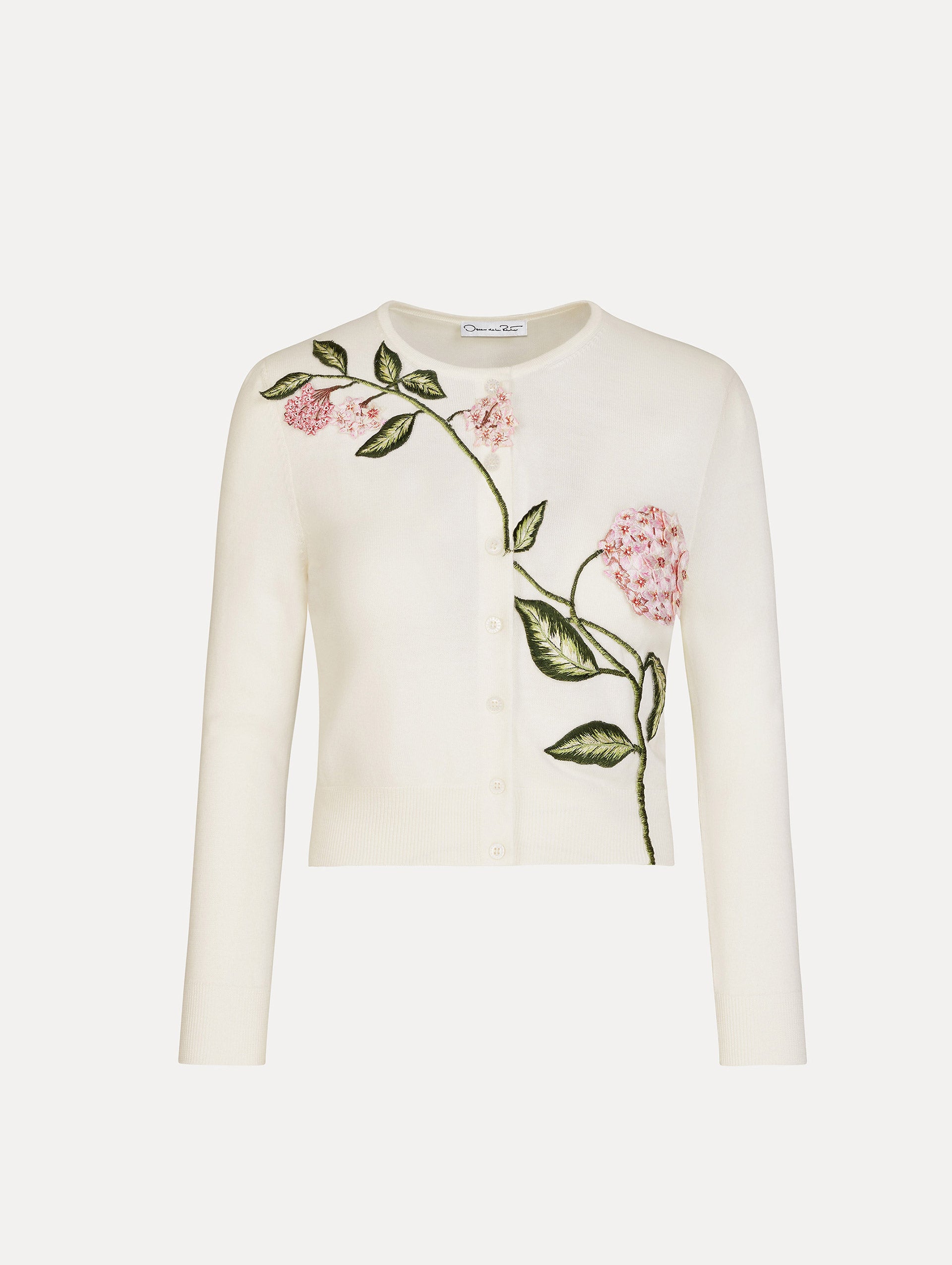 Porcelain Flower Threadwork Cropped Cardigan in white with button closure and floral embroidery along the neckline and shoulder.