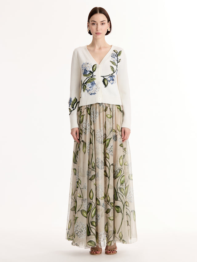 White Porcelain Flower Jacquard Cardigan featuring a V-Neckline and blue and green floral print. Front View.