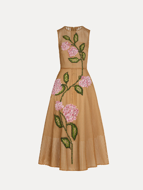 Porcelain flowers stitched with dimensional threadwork into an openwork lattice. Fitted bodice and flared skirt. Front View.