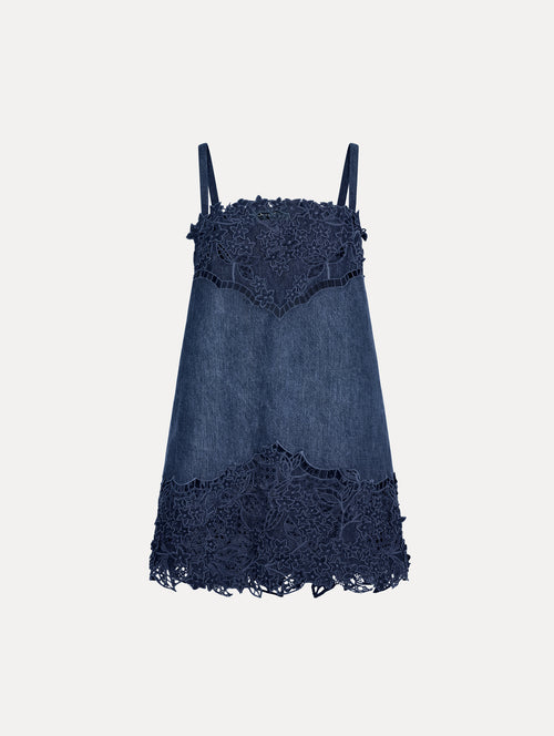 Mini dress in a Denim, Navy Blue color with intricate flower lace detail at neckline and skirt.
