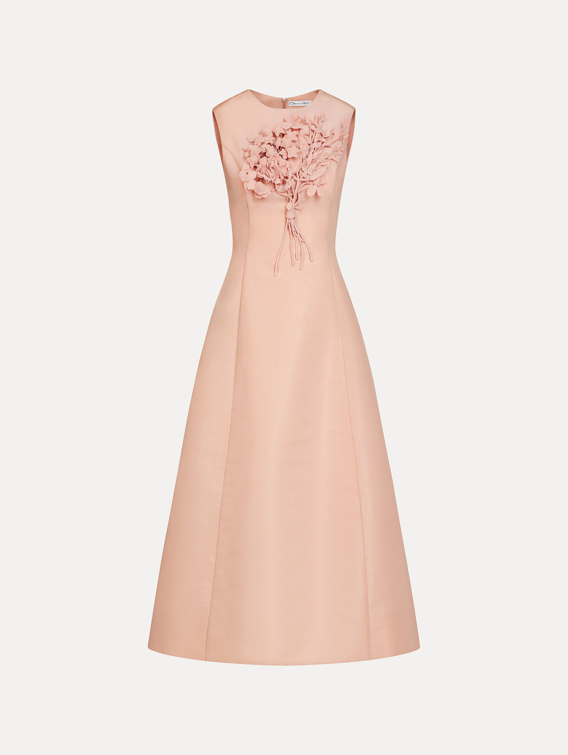 Blush pink cocktail midi dress. Centered, three dimensional hand-embroidered bouquet creating the illusion of a bouquet held close to the heart. Halter neck with flared skirt. Front View. 