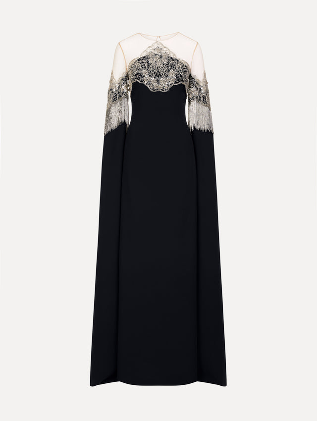 Caftan with sheer illusion tulle neckline and porcelain flower lattice. Hand-applied bugle beads around each motif, and fluid bugle bead fringe on sleeves. Front View. 