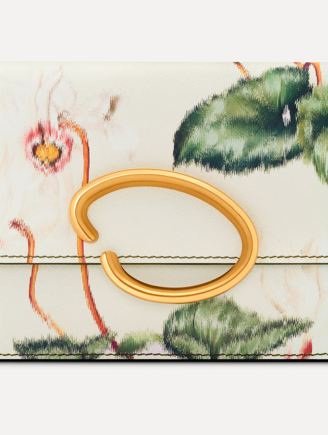Ivory Cyclamen-Printed O Pochette with green and pink floral motifs and gold hardware. Zoom View.
