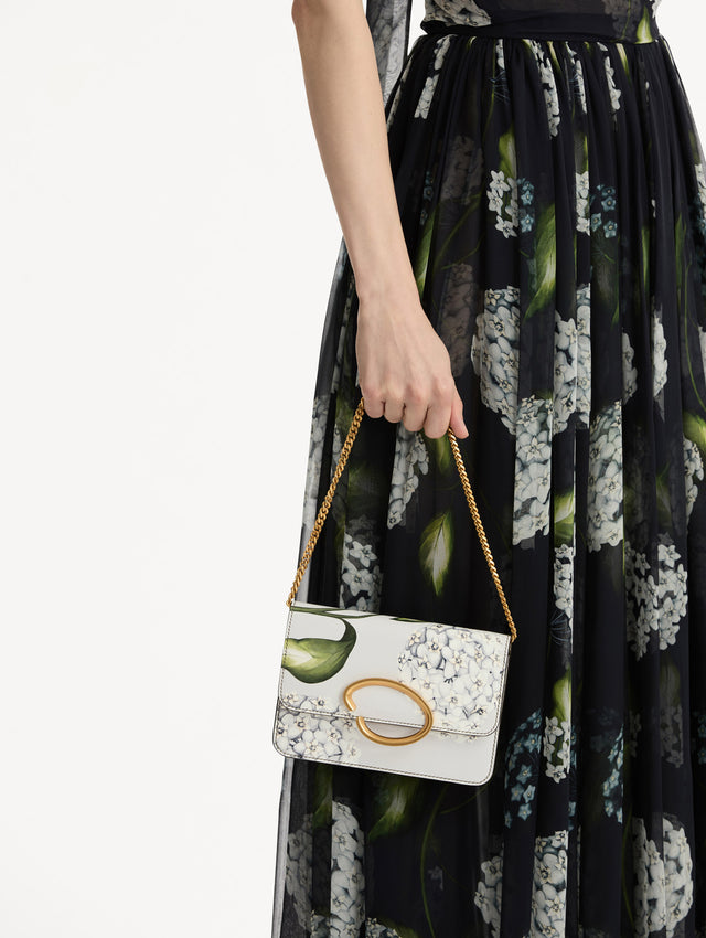 grey Porcelain Flower-Printed O Pochette with green and white floral motifs and gold hardware. Front view.