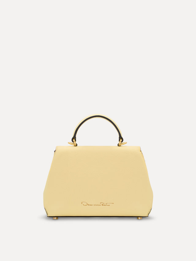 The Mini Poppy in yellow with floral cutout designs and gold hardware. Back View. 