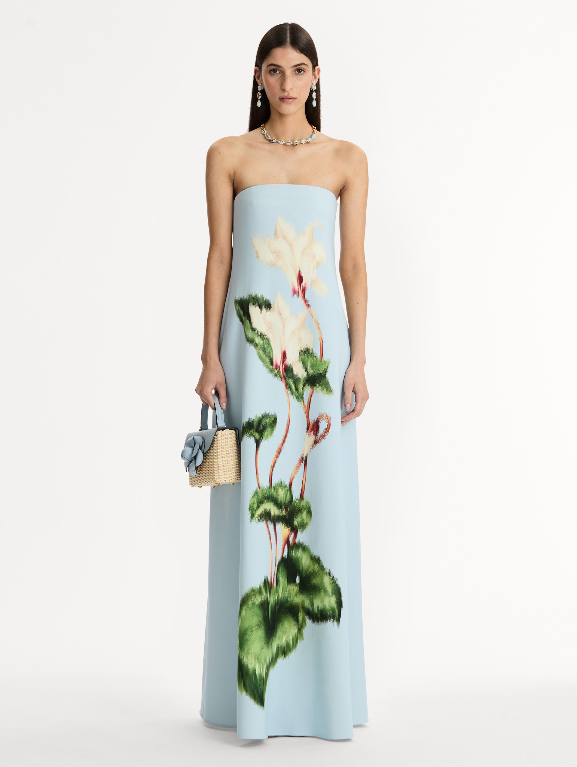 Blue Wicker Mini TRO Bag with a flower clasp and blue leather flap. Front View.