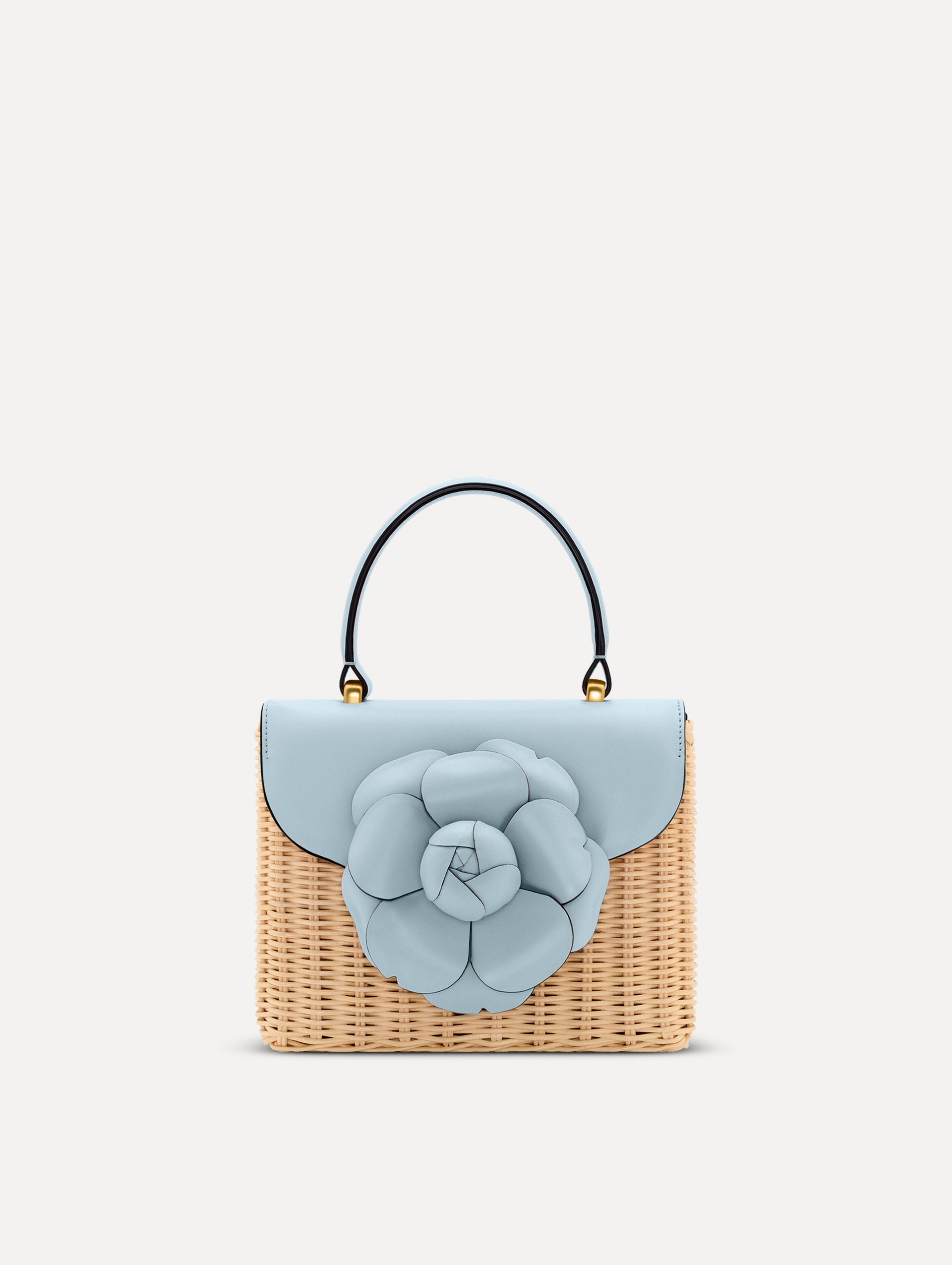 Blue Wicker Mini TRO Bag with a flower clasp and blue leather flap. Front View.