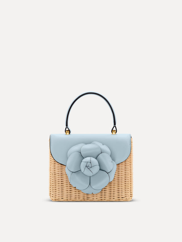 Blue Wicker Mini TRO Bag with a flower clasp and blue leather flap. Front View.