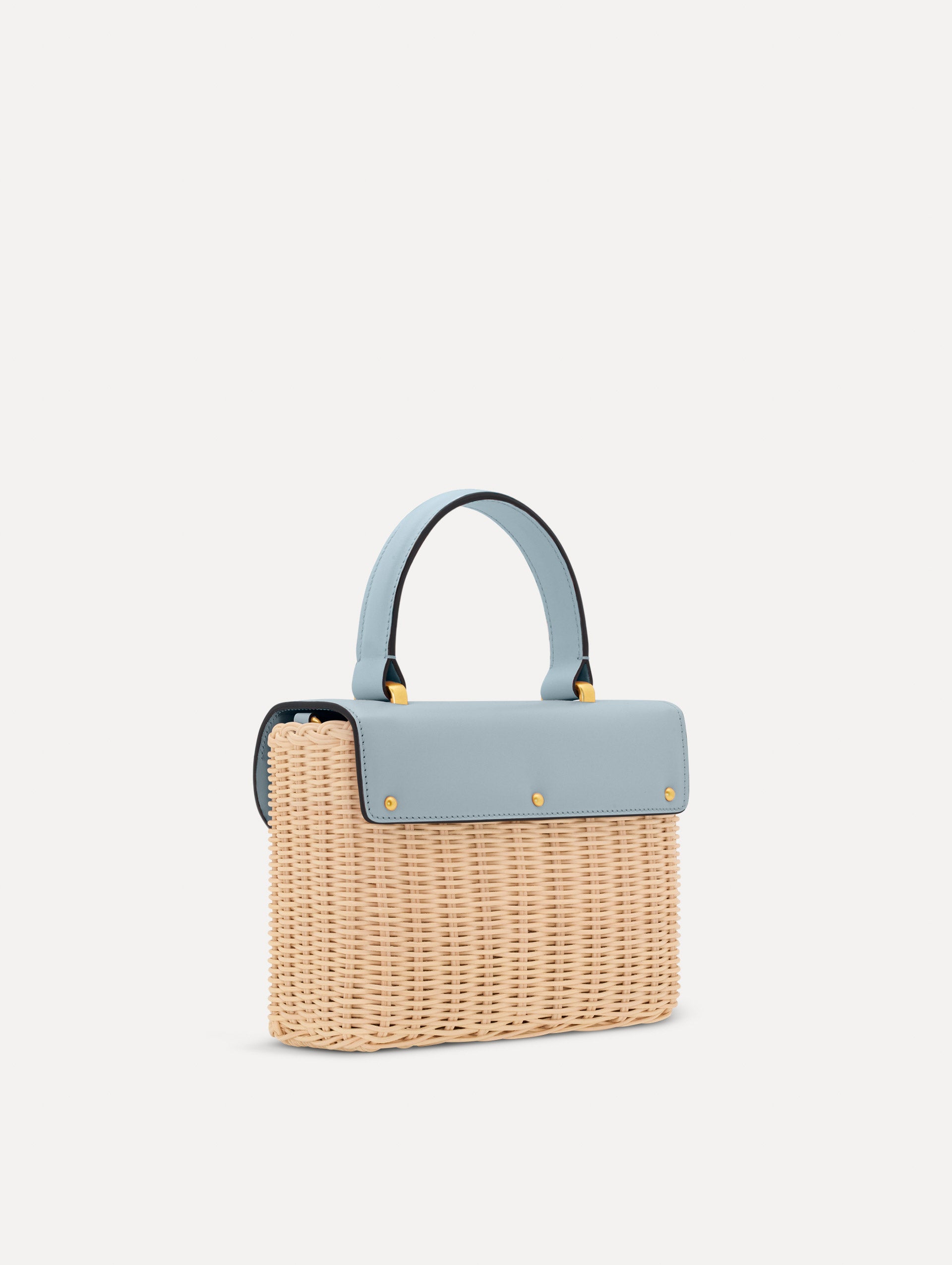 Blue Wicker Mini TRO Bag with a flower clasp and blue leather flap. Side View.