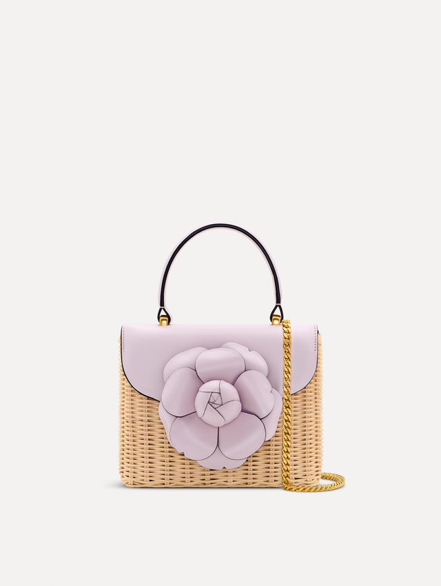lilac Wicker Mini TRO Bag with floral motif clasp and leather flap. Front View.