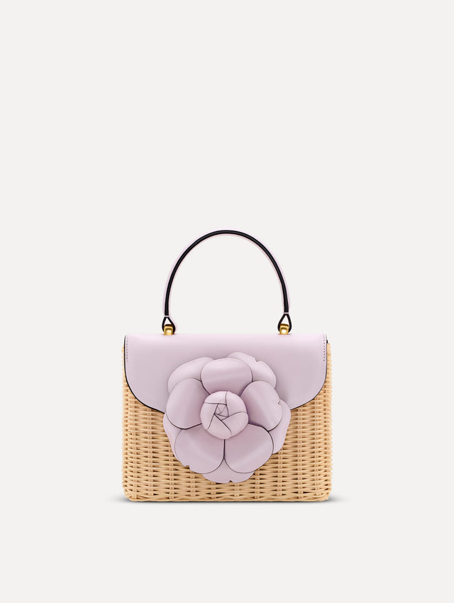lilac Wicker Mini TRO Bag with floral motif clasp and leather flap. Front View.