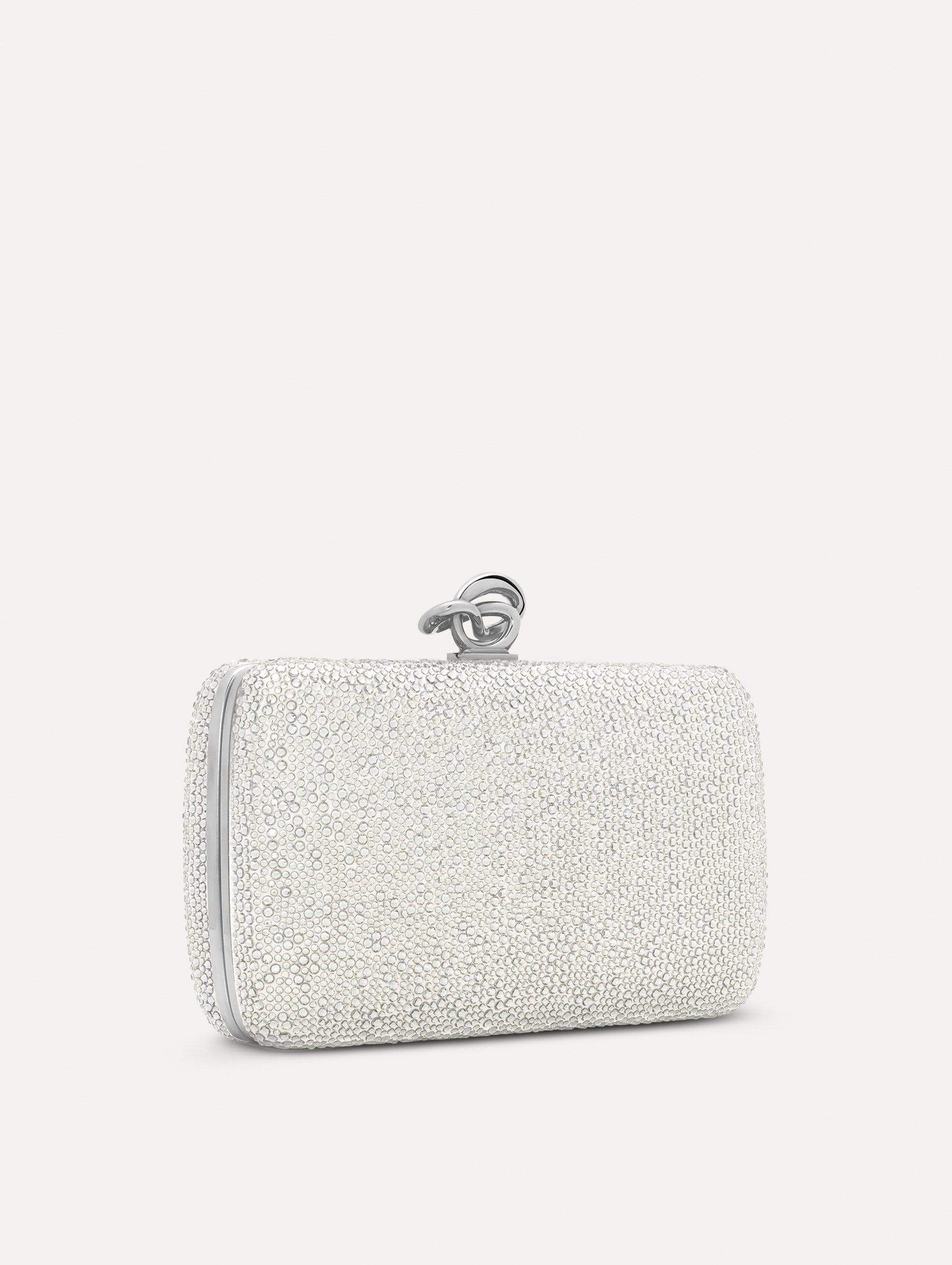 Silver Crystal Pavé Knot Minaudière with gold hardware and an O motif clasp.  Side View.