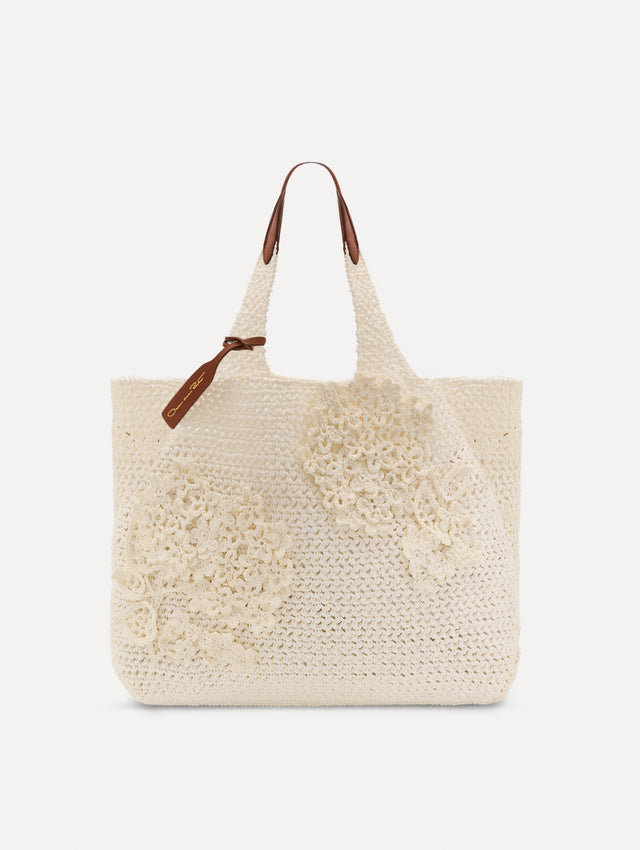 White Topaz in Crochet Raffia with white leather handle and crochet embroidered flower motifs. Front View.