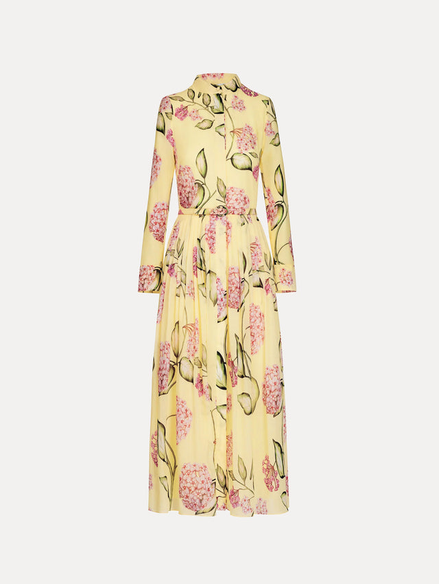 Porcelain Flower Cotton Poplin Long-Sleeve Dress in the color Pink and Butter Yellow with a printed floral motif. Features a pleated skirt, concealed button front, and belt at waist.