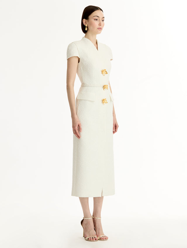 Ivory Cyclamen-Detailed Wool Tweed Dress with belted waist and floral motif gold buttons. Side View.