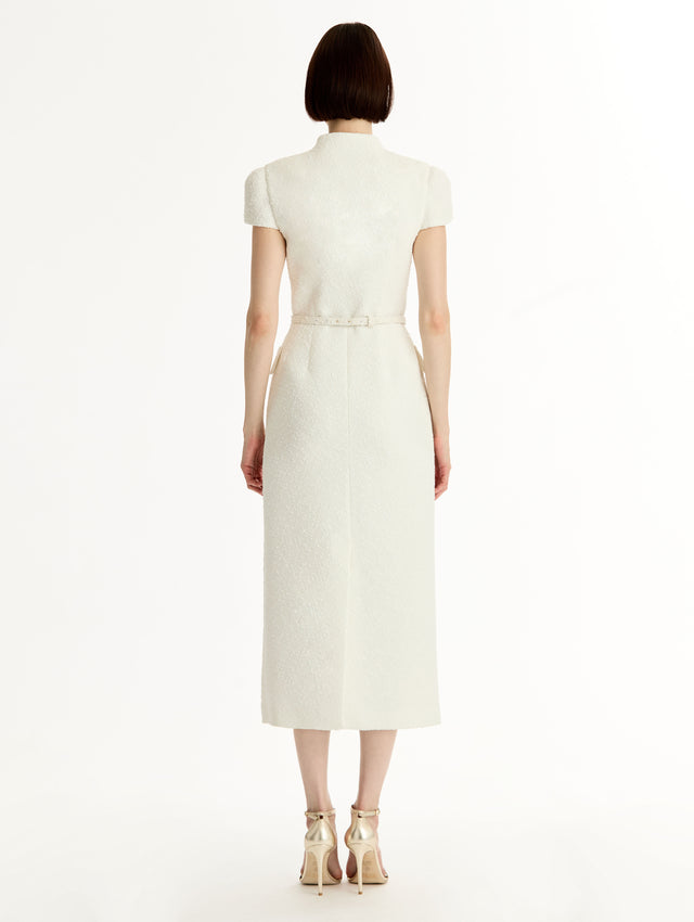 Ivory Cyclamen-Detailed Wool Tweed Dress with belted waist and floral motif gold buttons. Back View.
