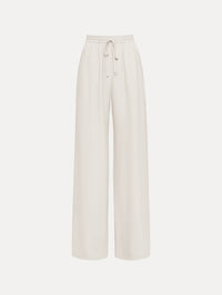 The Silk Georgette Drawstring Pant in the color ivory featuring straight, wide-legs and an elastic waistband finished with a drawstring tie. Front View.