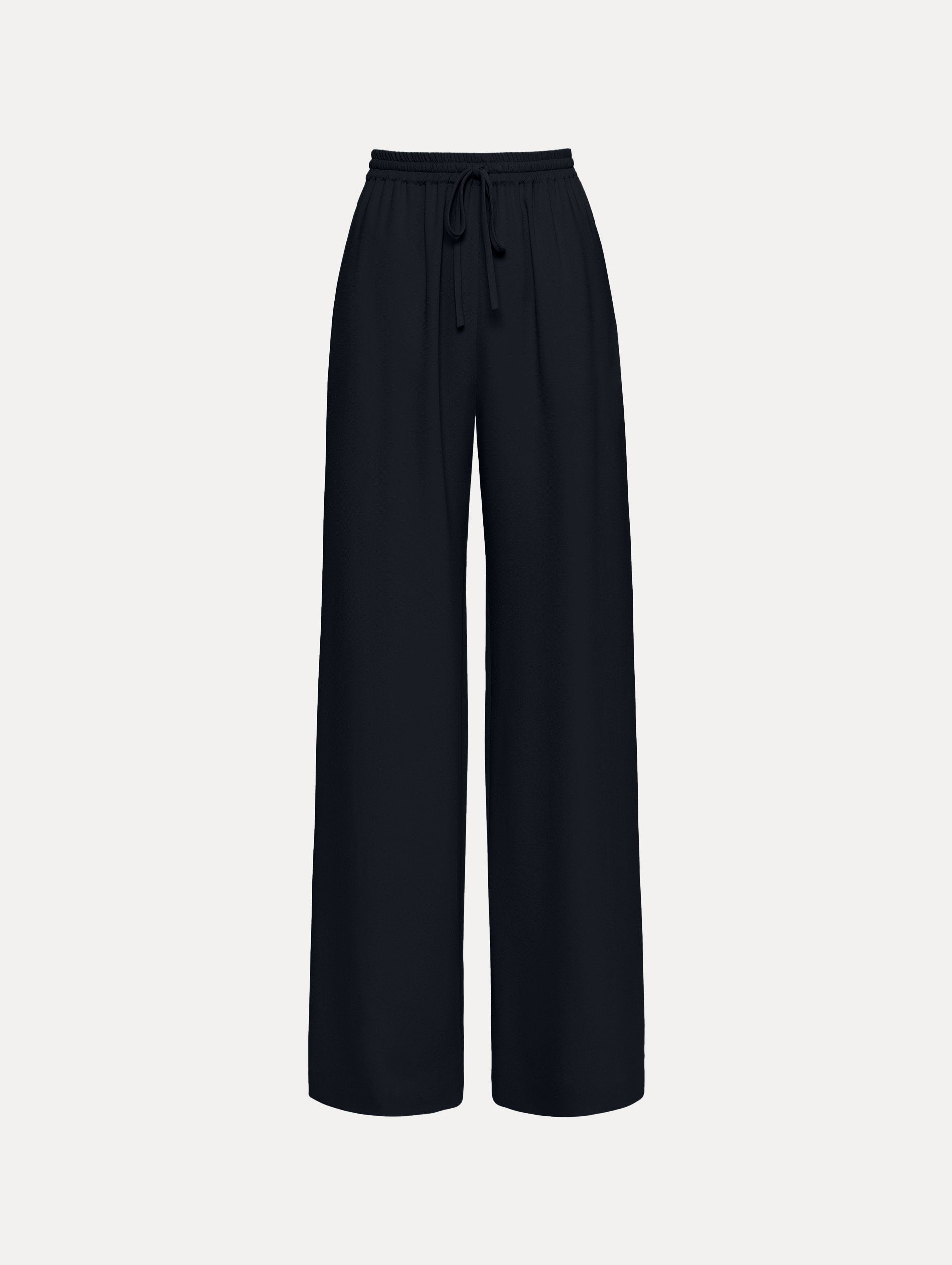 The Silk Georgette Drawstring Pant in the color navy blue featuring straight, wide-legs and an elastic waistband finished with a drawstring tie. Front View.
