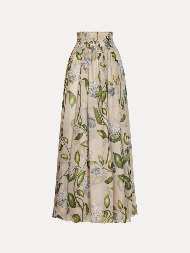 Oatmeal Porcelain Flower Chiffon Maxi Skirt featuring a smocked high waist and a flowing A-line silhouette with green and blue floral print. Front View.