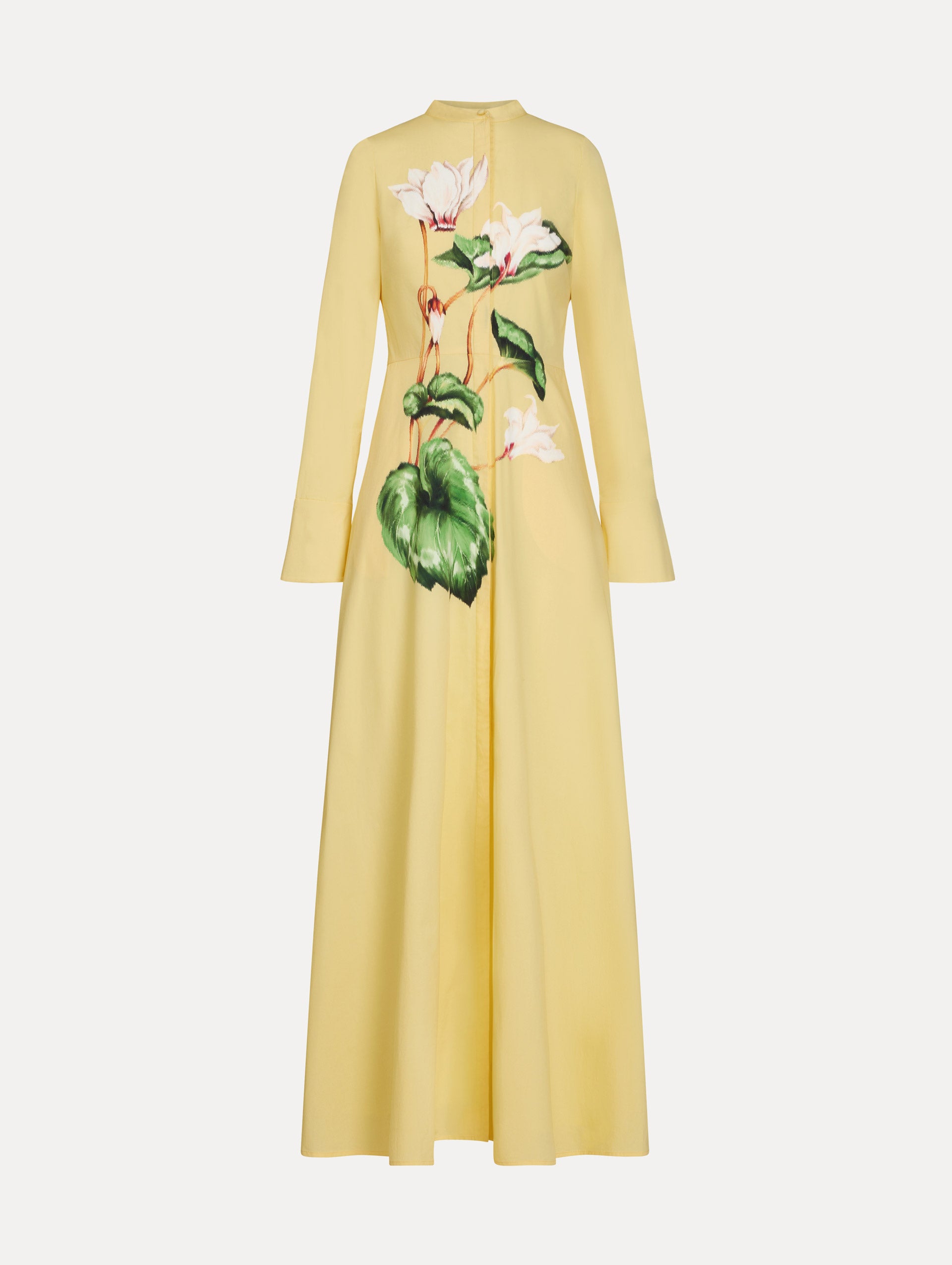 Yellow cotton poplin caftan with a mandarin collar and concealed button front. Chiné Cyclamen motif softly blurred, edges. Full-length sleeves. Front View. 