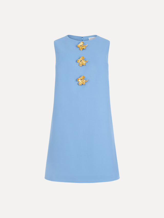 The Button-Detail Wool Shift Dress in the color Hydrangea blue in a mini-length, featuring bold, floral gold buttons. Front View.