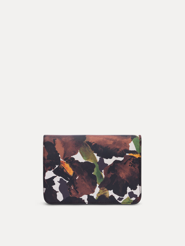 The model is carrying an iris printed saffiano O pochette. Back view.