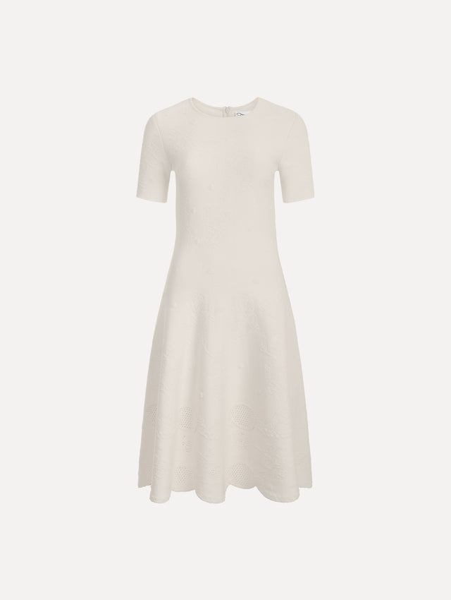 The image depicts a fit and flare knit jacquard dress. Front view.