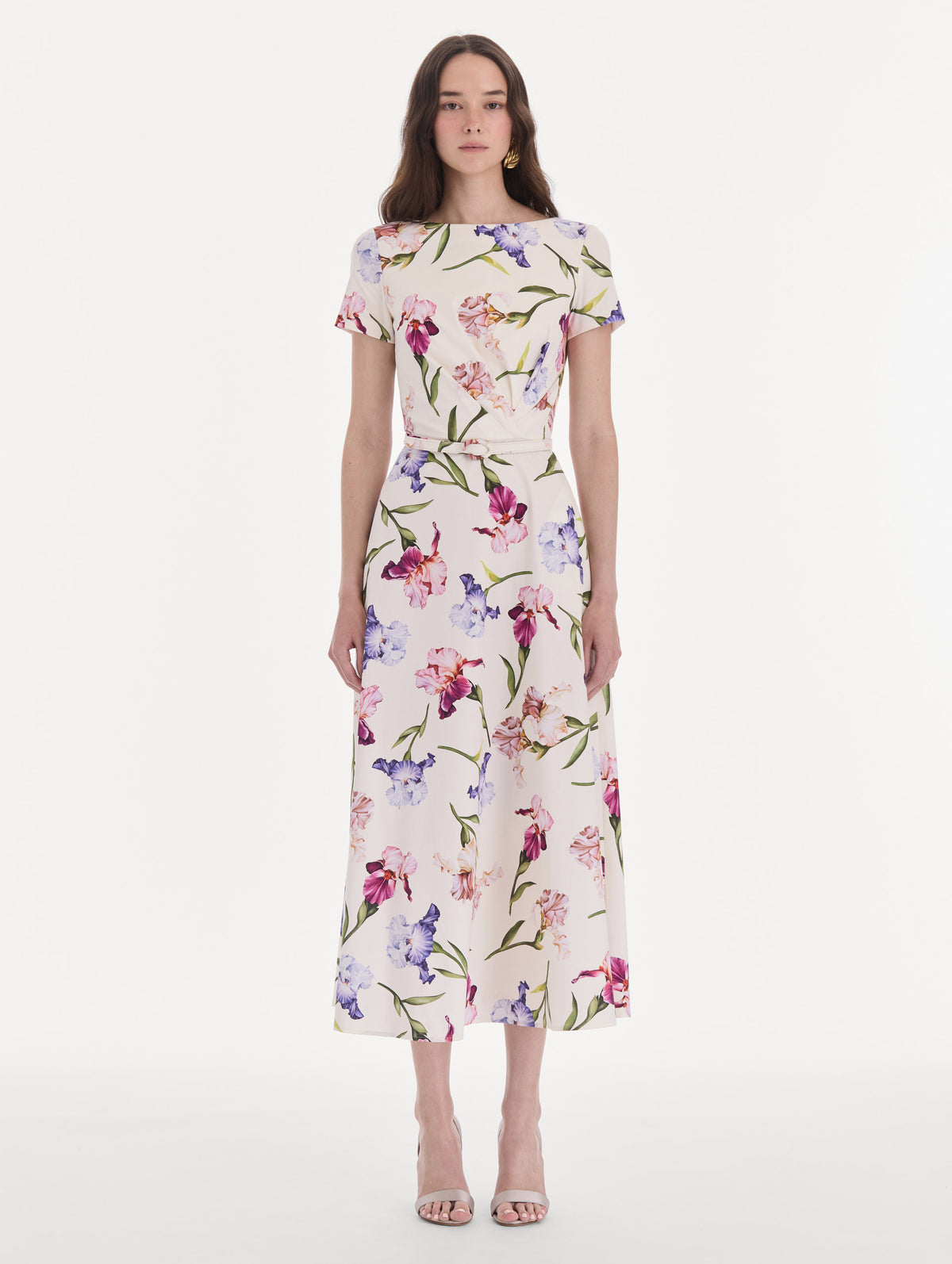 The model is wearing a short sleeve iris flowers poplin day dress. Front view.