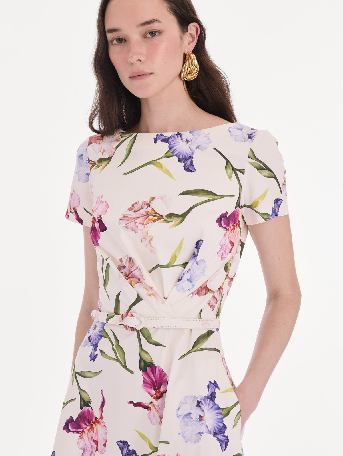 The model is wearing a short sleeve iris flowers poplin day dress. Zoom view.