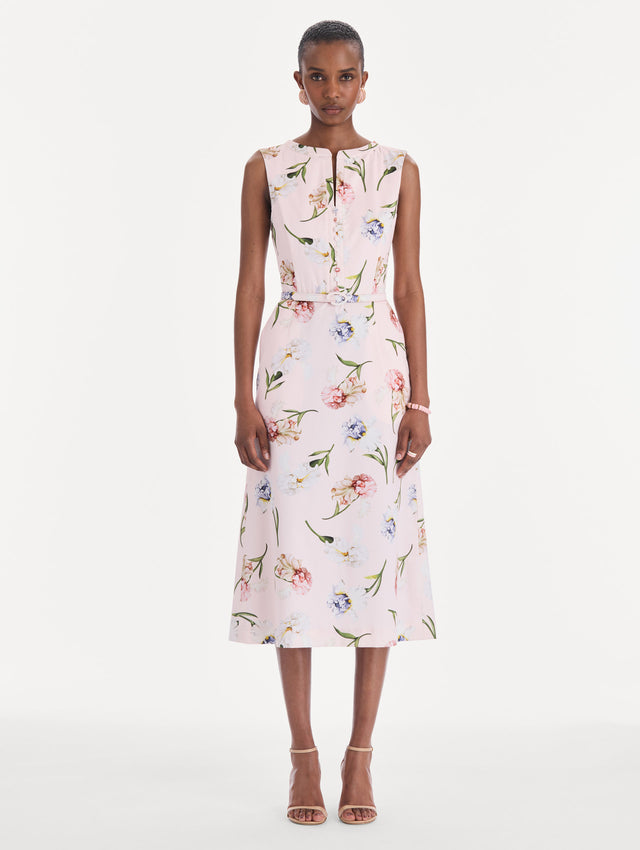 The model is wearing a sleeveless painted iris poplin day dress. Front view.