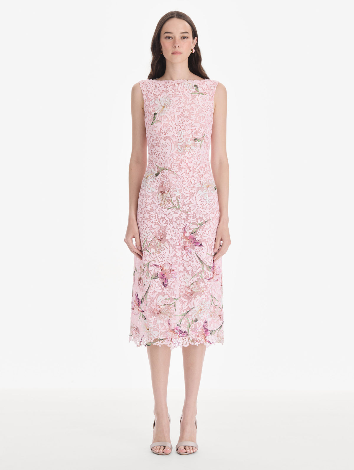 The model is wearing a cape sleeve painted iris degrade lace day dress. Side view.