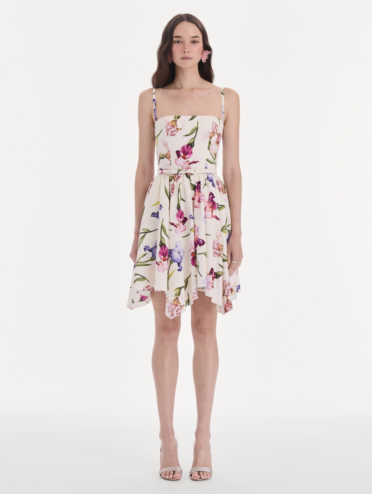 The model is wearing a sleeveless iris flowers poplin day dress. Front view.