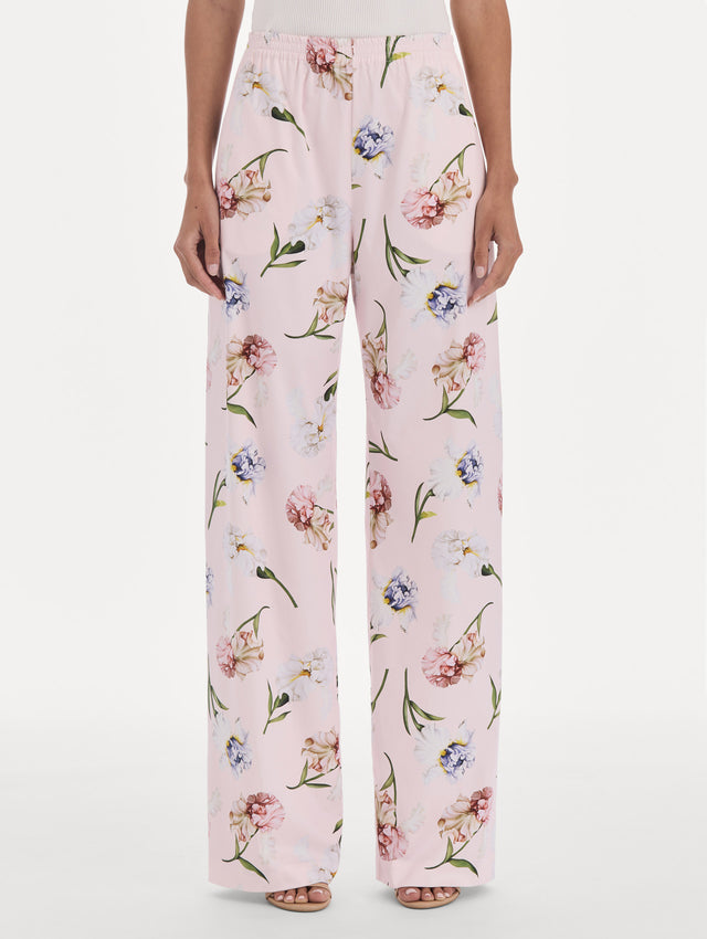 The model is wearing a painted iris poplin pant. Side view.
