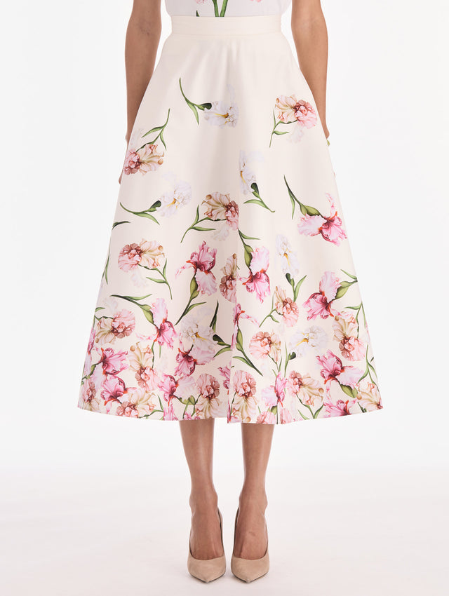 The model is wearing a painted iris degrade poplin A-line skirt. Side view.