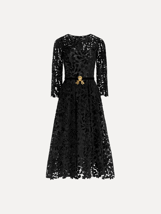 The image depicts a long sleeve chrysanthemum guipure cocktail dress. Front view.