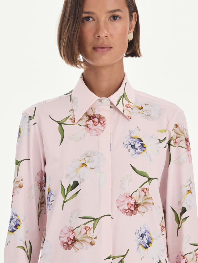 The model is wearing a long sleeve painted iris poplin blouse. Zoom view.