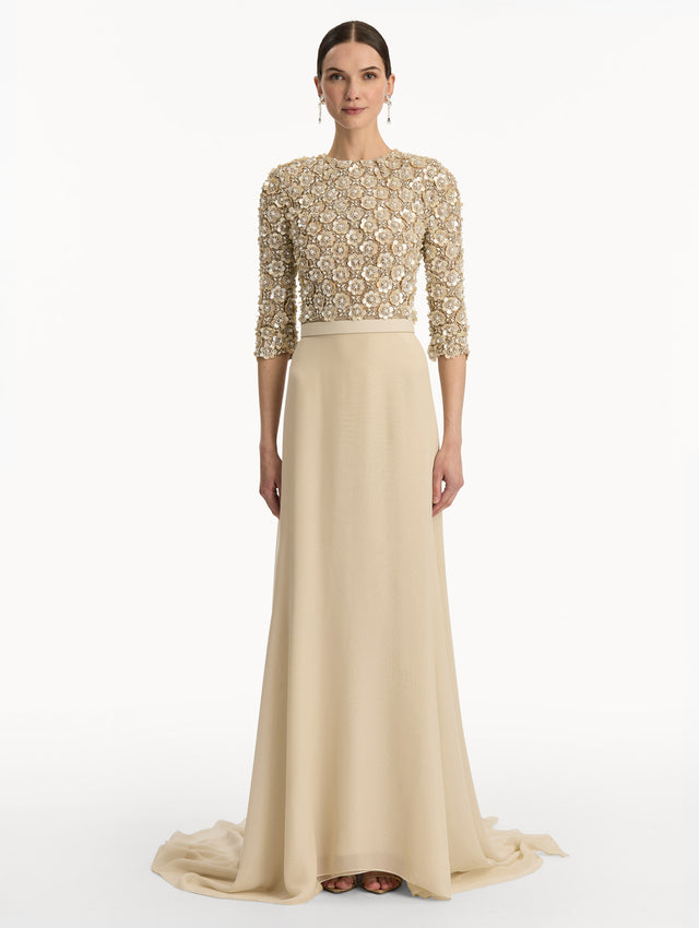 Bone Mother of Pearl Embroidered Gown with long, belted skirt and long sleeve embroidered bodice. Front View.
