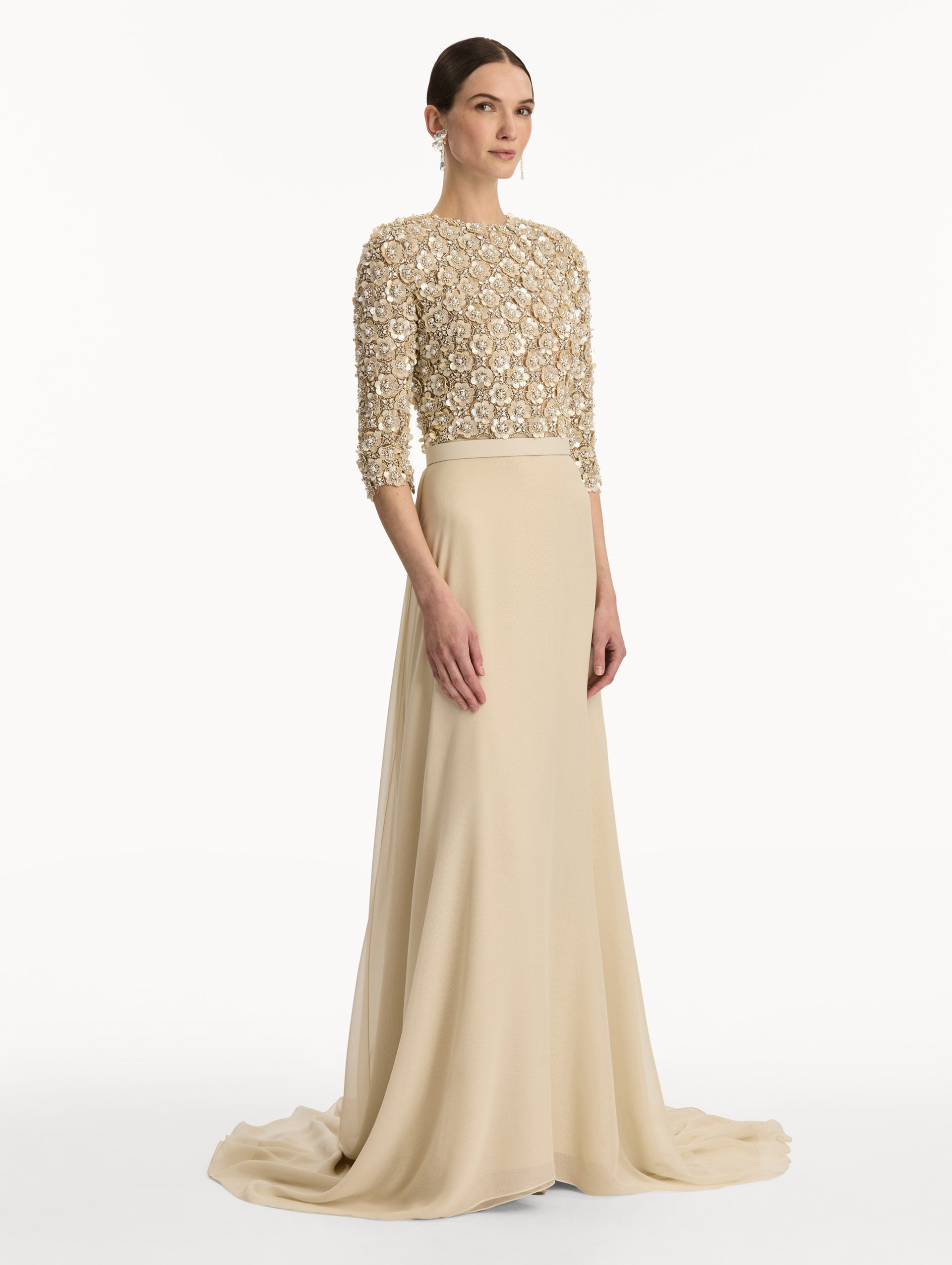 Bone Mother of Pearl Embroidered Gown with long, belted skirt and long sleeve embroidered bodice. Side View.