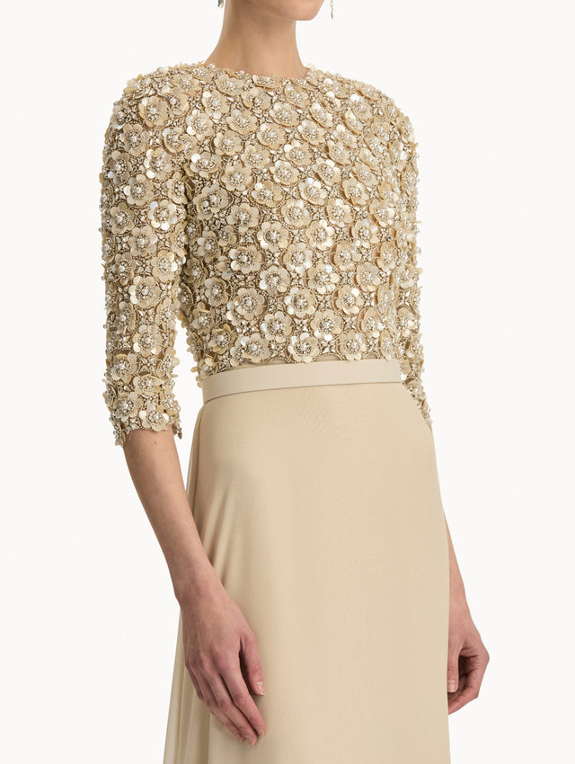 Bone Mother of Pearl Embroidered Gown with long, belted skirt and long sleeve embroidered bodice. Zoom View.