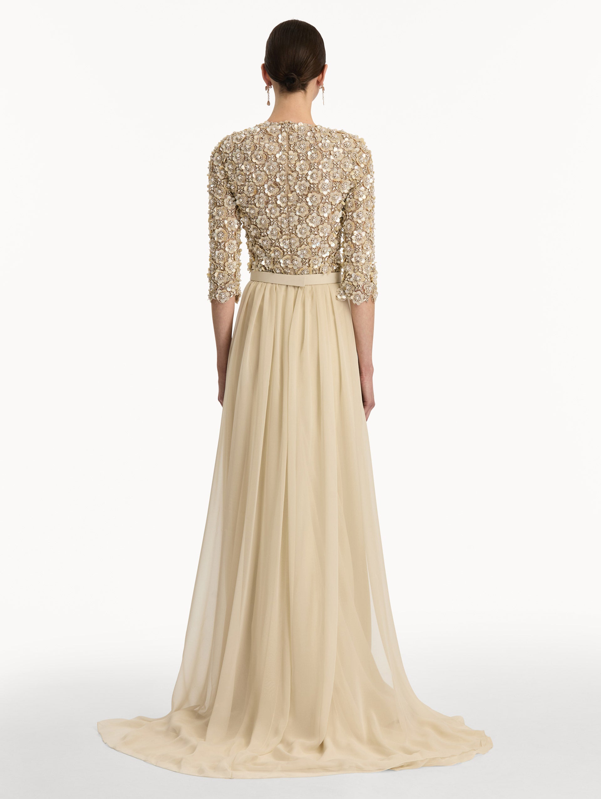 Bone Mother of Pearl Embroidered Gown with long, belted skirt and long sleeve embroidered bodice. Back View.