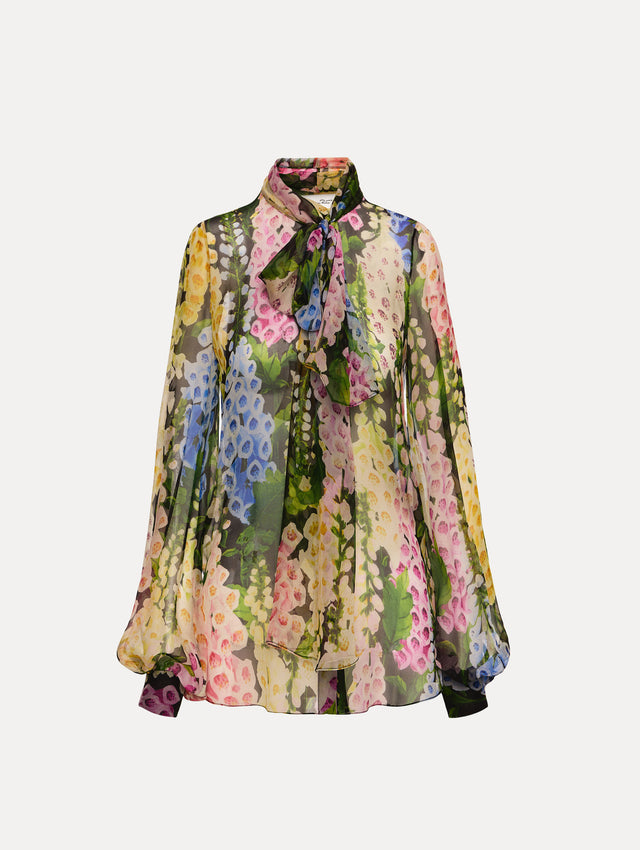 Black and floral Foxglove Tie-Neck Chiffon Blouse with billowing long sleeves with cuffed wrists.