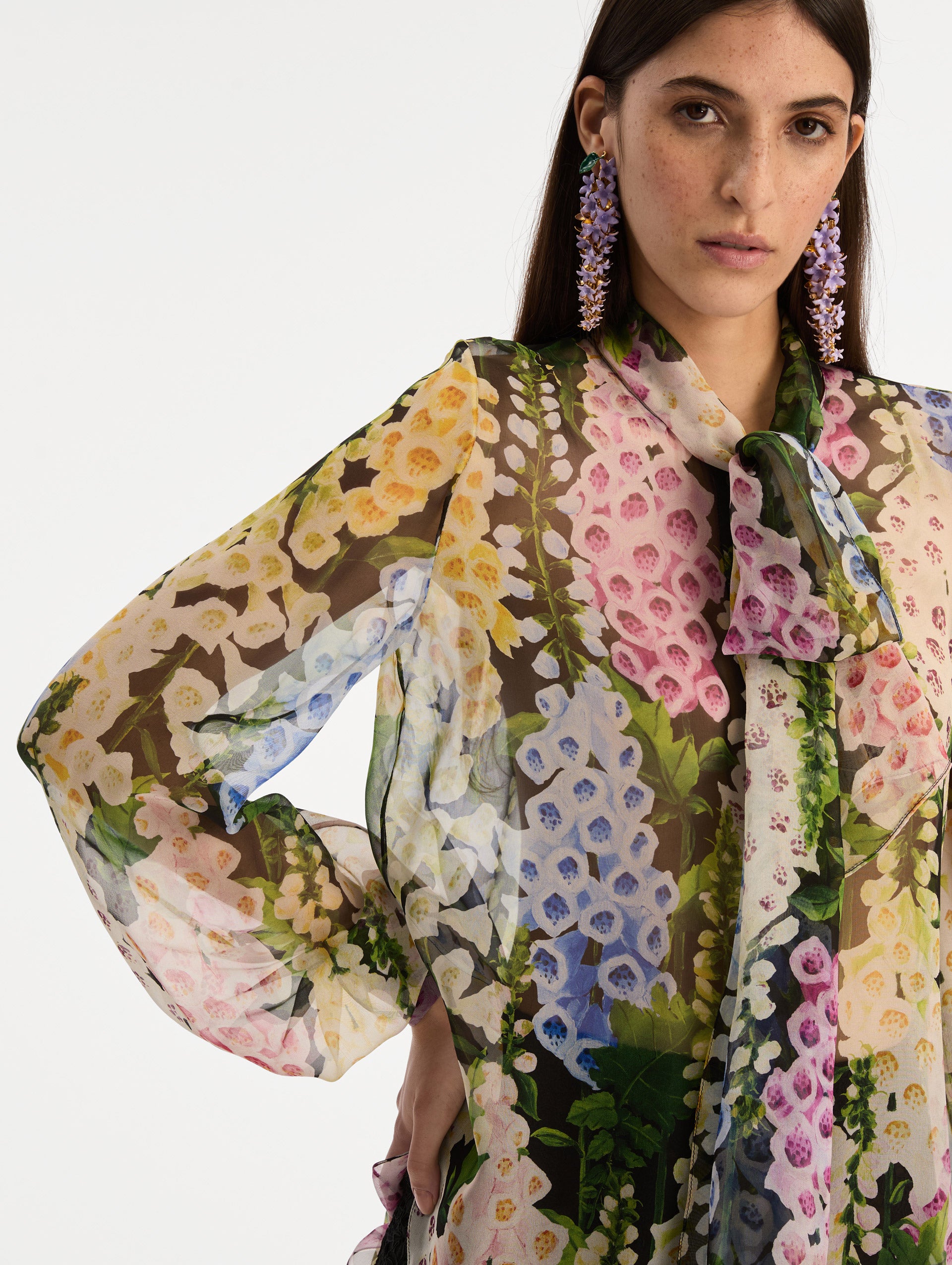 Black and floral Foxglove Tie-Neck Chiffon Blouse with billowing long sleeves with cuffed wrists. Zoom View.