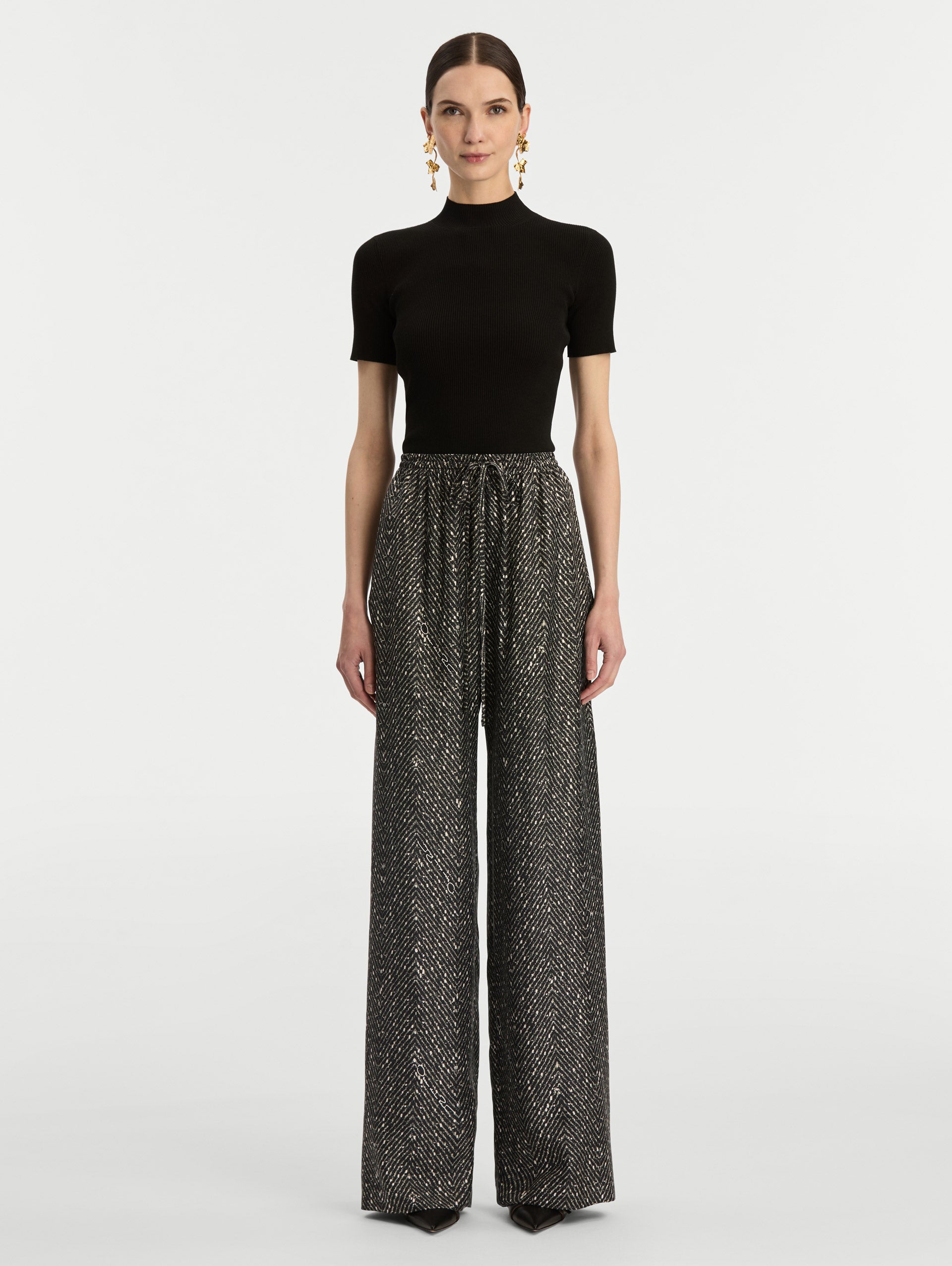 Black and Ivory Chevron Silk Twill Drawstring Pant featuring a high elastic waistband and fluid, shimmering drape. Front View.