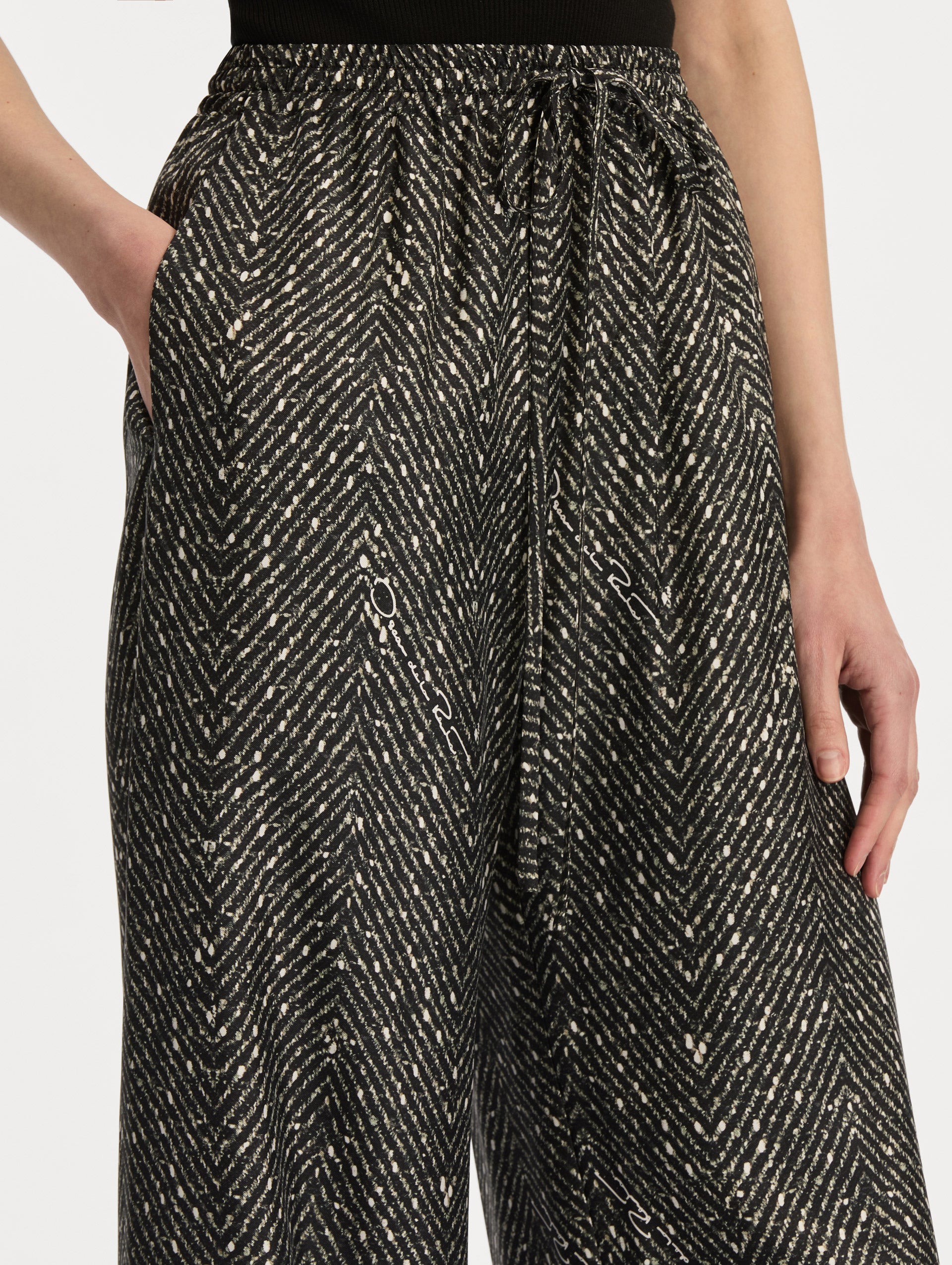 Black and Ivory Chevron Silk Twill Drawstring Pant featuring a high elastic waistband and fluid, shimmering drape. Zoom View.